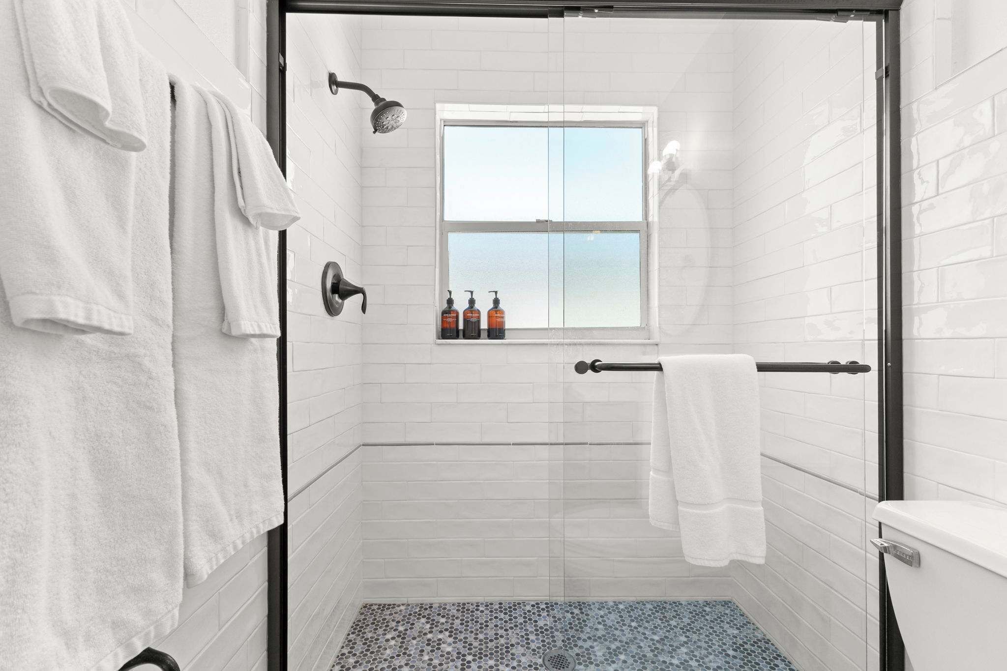 Shower, hair dryer, towels, shampoo