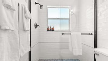 Shower, hair dryer, towels, shampoo