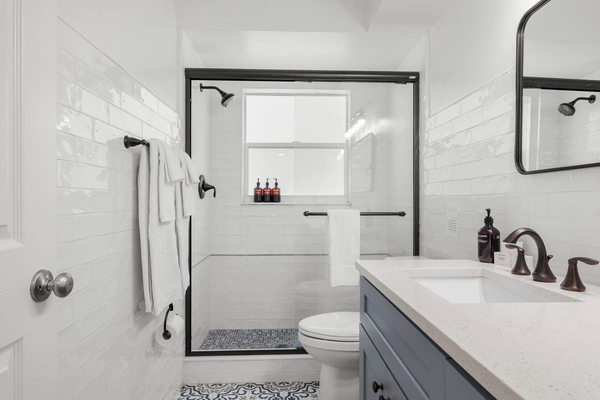 Shower, hair dryer, towels, shampoo