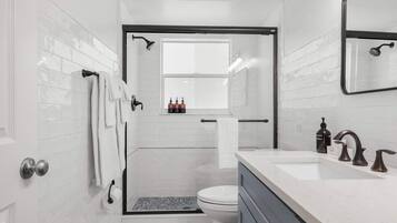 Shower, hair dryer, towels, shampoo