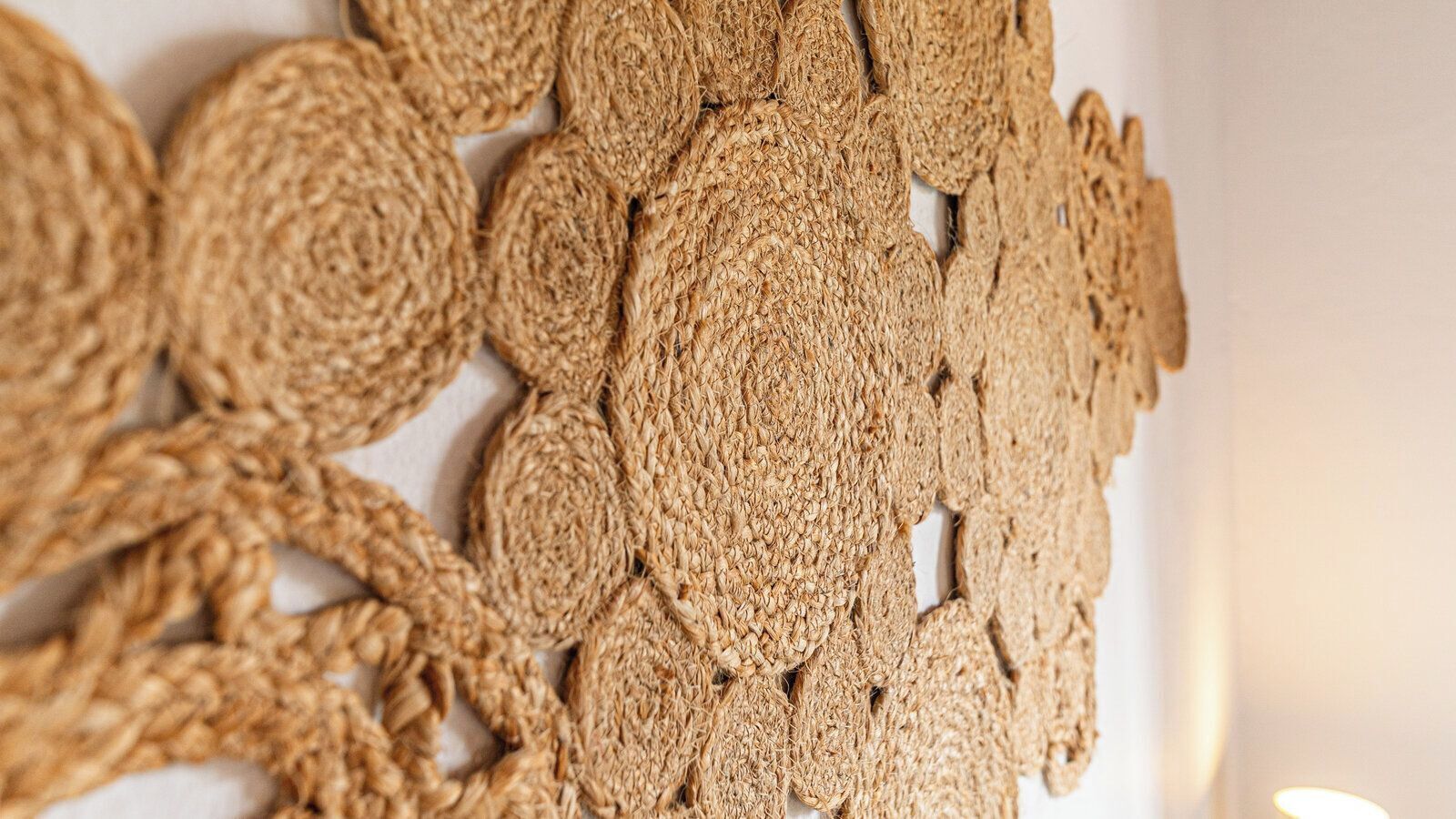 A close-up of a textured wall with a woven pattern.