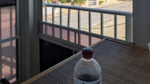 A bottle on a table with a view of the ocean and a house through a window. - The Friendly Pelican
2-BDR 2-BATH on a canal w/AC in Big Pine Key (Big Pine Key)
