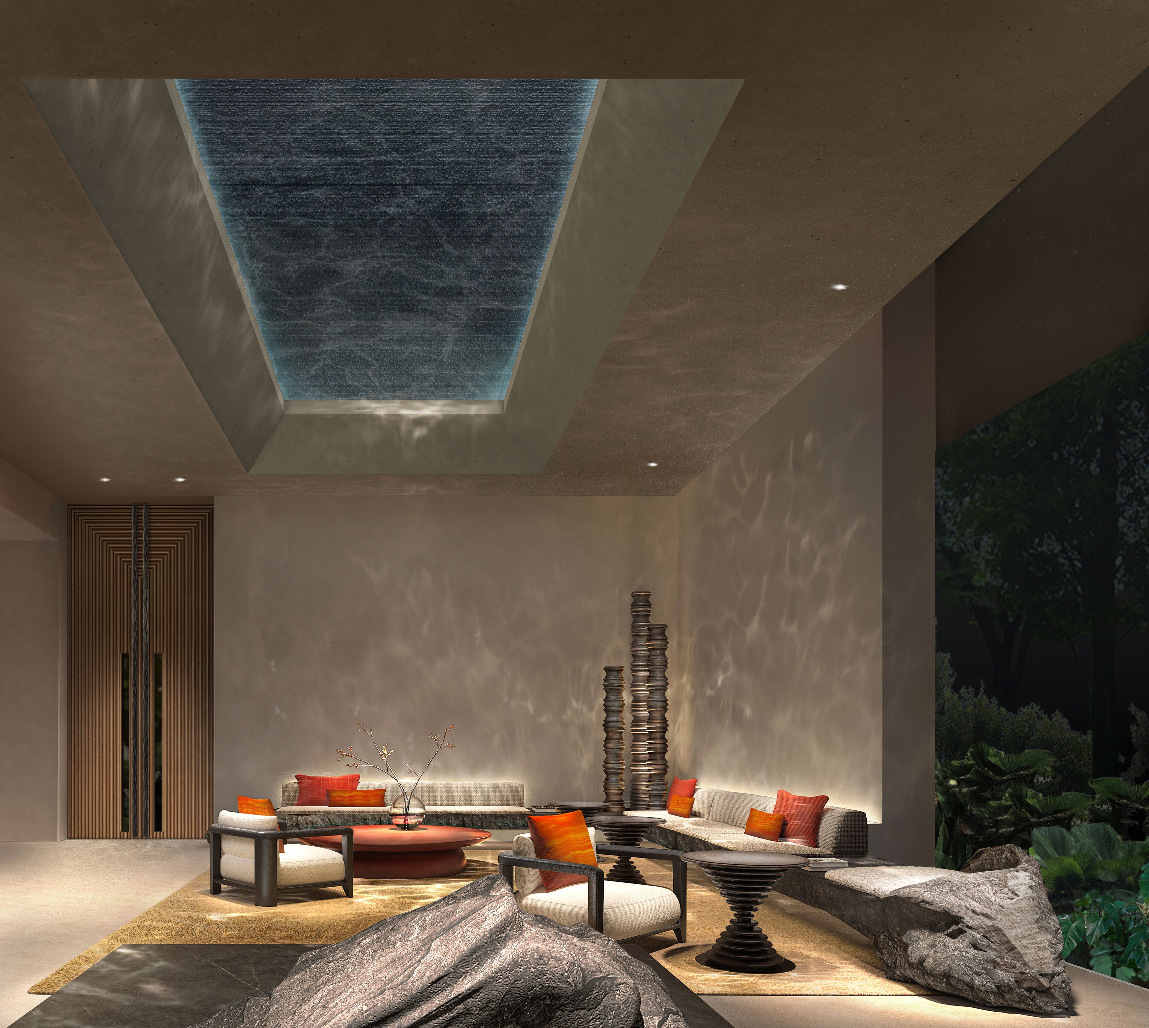 A modern interior with a seating area, a tall decorative structure, and a skylight.