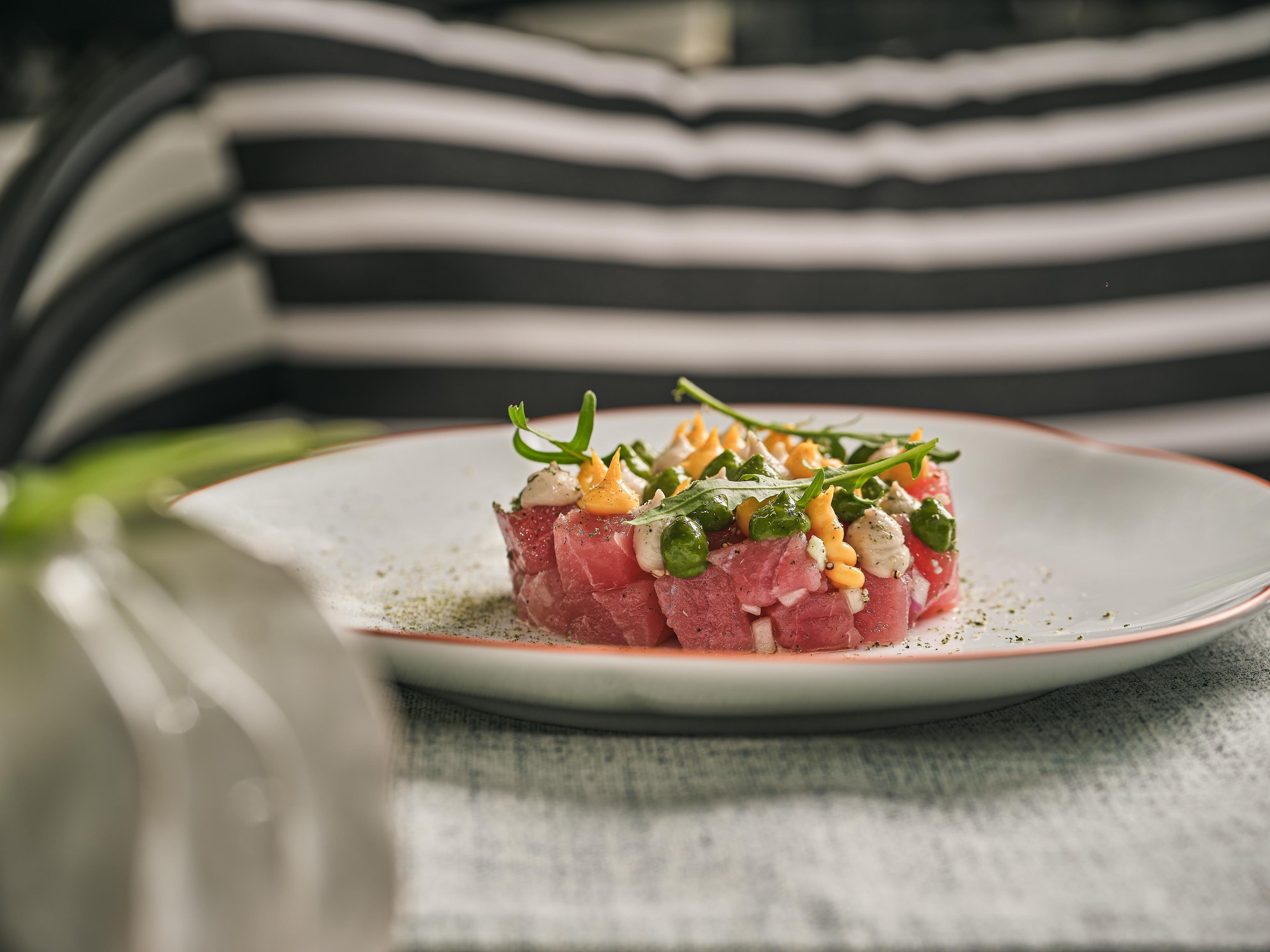 A plate of food with a striped background.