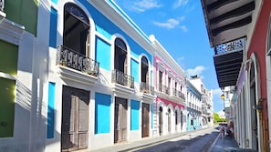 A street with colorful buildings, balconies, and a clear sky. - Spanish Colonial Retreat in Old San Juan (San Juan)