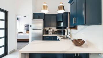 Fridge, microwave, stovetop, coffee/tea maker