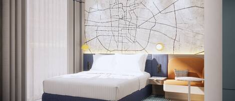 A modern hotel room with a large bed, a nightstand, a lamp, and a map on the wall.