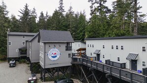 A multi-story building with a prominent tower labeled "Terrace Beach Resort" and "Ucluelet, BC". - Steps to Terrace Beach & Trails • Whale’s Tail (Ucluelet)