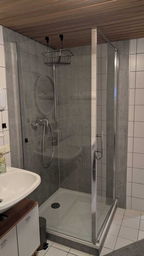 Shower, towels, soap, toilet paper
