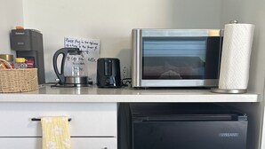 A kitchenette with a coffee maker, toaster, microwave, and a VISSANI refrigerator. - Quiet Private Room Victoria - PS5, Fast WiFi, Parking (Langford)