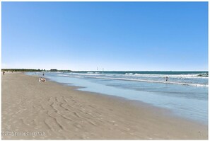 On the beach, sun loungers, beach towels