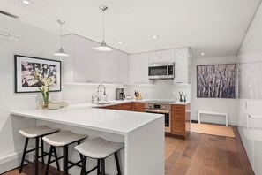 Fridge, microwave, oven, stovetop - Luxe Aspen Retreat with A/C, Garage Parking, Ski Locker & Walkable Gondola Access (Aspen)