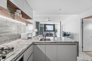 Fridge, microwave, oven, stovetop - Luxury 54F Skyline Apt | Iconic Queen’s Wharf 1BR (Brisbane City)