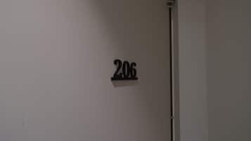 A wall-mounted sign with the number '206'.