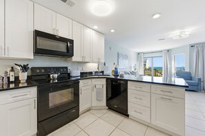 Fridge, microwave, stovetop, dishwasher - Ocean Mile K-6 ~ Salty Smiles! Offers unobstructed pool front and Gulf views! Newly renovated! (St. George Island)