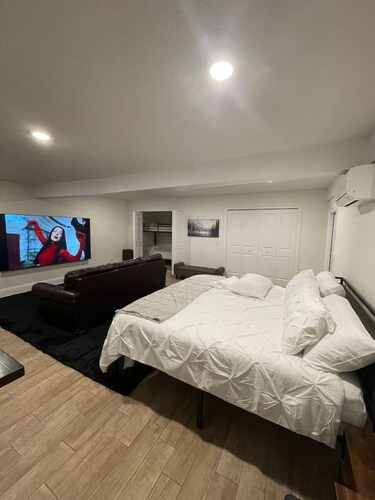 Poolside Suite | 98” TV | Sleeps 7 | 3 Rooms