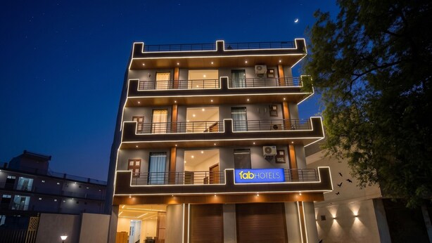 A multi-story building with a sign for 'fab hotels' and balconies. - Fabhotel Sky Sector 76 (Gurugram)