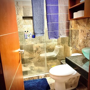 A bathroom with a shower, toilet, and sink. - Apartment C (Zona Romantica) (Puerto Vallarta)
