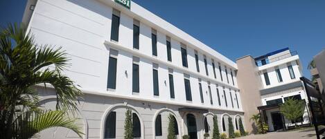 A modern building with a sign reading 'RSI' on the top. It has multiple windows and a flat roof.
