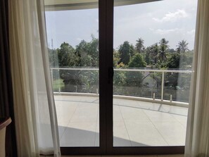 Luxury Suite, Garden View | Living area | 43-inch LED TV with digital channels - Kottayam Grand Hotel -Convention Centre (Arpookara)
