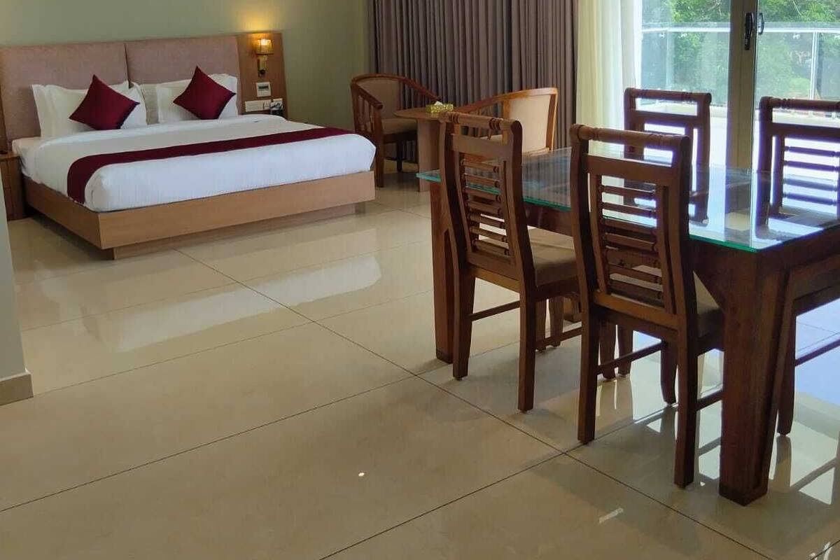 Luxury Suite, Garden View | Living area | 43-inch LED TV with digital channels