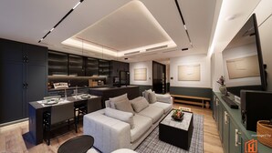 A modern living room with a sofa, coffee table, and a dining area with a table and chairs. - A HOUSE SAIGON (Ho Chi Minh City)