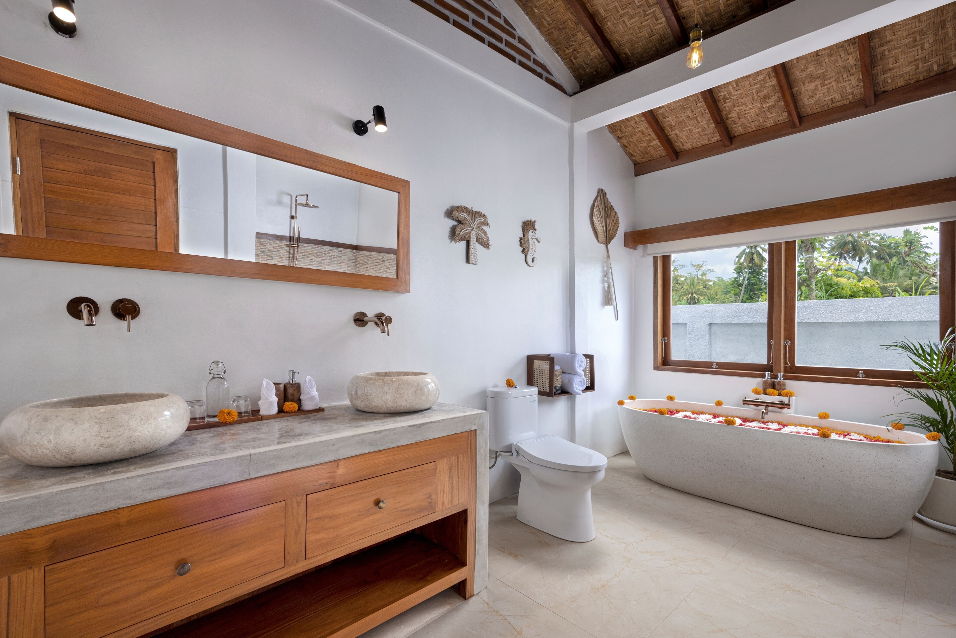 Separate bathtub and shower, towels, soap, shampoo