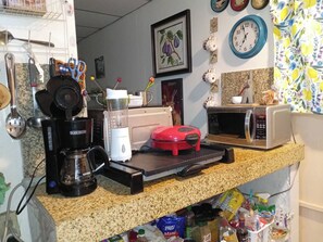 Microwave, oven, coffee/tea maker, cookware/dishes/utensils