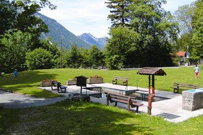A park with benches, a gazebo, and a playground area. - Beautiful Lodging in the Alps Near Bayrischzell (Bayrischzell)