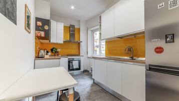 Apartment, Balcony, City View | Private kitchen | Fridge, oven, stovetop, dishwasher