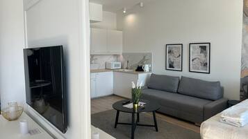 Suite Studio Confort, balcon, vue ville | Coin séjour