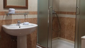 A bathroom with a sink, mirror, and shower. - Apartments Aleksić, Bečići (Bečići)