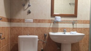 A bathroom with a toilet, sink, and shower. - Apartments Aleksić, Bečići (Bečići)