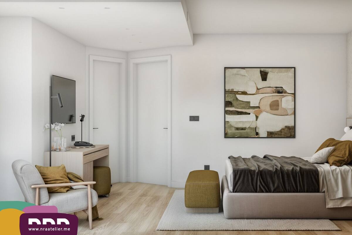 A modern bedroom with a bed, bedside table, chair, desk, and artwork.