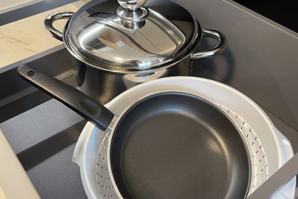 A stove with a pot and pan on it.