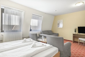 Comfort Quadruple Room, City View | Desk, laptop workspace, blackout drapes, iron/ironing board