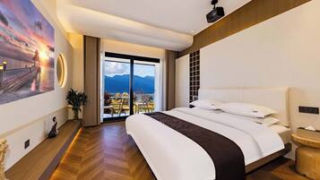 Deluxe Double Room, Lake View | Minibar, desk, laptop workspace, blackout drapes