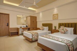 Deluxe Room, City View | In-room safe, desk, laptop workspace, blackout drapes
