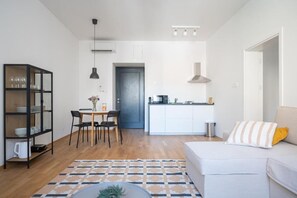 Apartamento Deluxe, vistas a la ciudad | Zona de estar