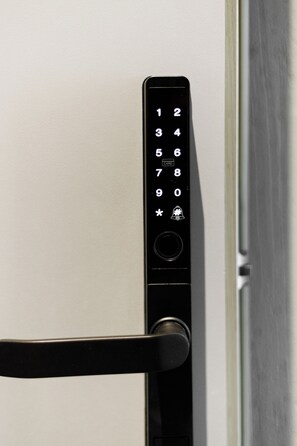 A door with a numeric keypad lock, a card slot, and a bell button. - Notre Dame City Residence (Nice)