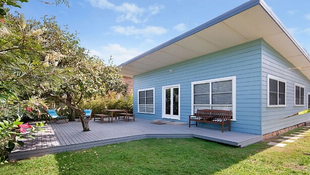 A house with a covered patio, a lawn, and a tree. - My Blue Heaven Dog Friendly (Lennox Head)