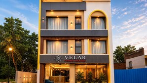 A multi-story hotel with a modern facade, large windows, and a prominent entrance. - Velar Prime Hotel, Vijay Nagar, Indore (Indore)