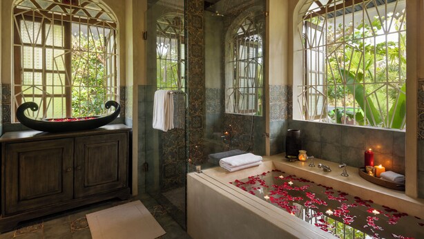 A bathroom with a bathtub, a glass shower enclosure, and a vanity with a decorative basin. - Staymaster Samba Sunset 3BR Pvt Pool (Anjuna)