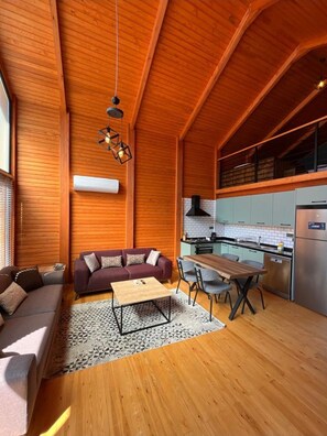 Villa Premier, vista al jardín | Área de sala de estar