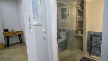 Shower, hair dryer, towels, soap