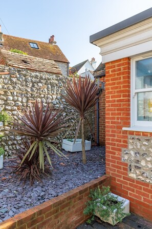 Property grounds - A charming one-bedroom garden cottage tucked away in the heart of Rottingdean village. Bright, cosy and full of character, it’s just a short walk to the beach, cafés and pubs, with easy access to Brighton for the perfect seaside escape. (Rottingdean)