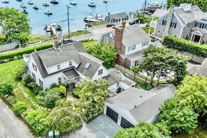 A residential area with houses, a marina, and a road. - Close to Beach, Harbor Out Front, Village Around the Corner! RPAM122 (Harwich Port)