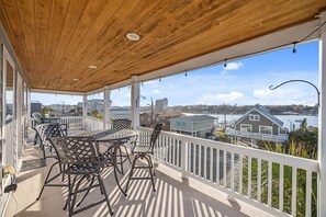Outdoor dining - Hightide #215 | Ocean & Sound Views | Crow’s Nest + Elevator | Sleeps 15 (Carolina Beach)