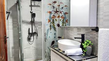 Shower, towels, soap, toilet paper
