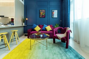 Deluxe Apartment, 1 Bedroom | Living area | 65-inch Smart TV with digital channels, Netflix, streaming services - Colorful Designer Retreat - Luxury  (Dubai)